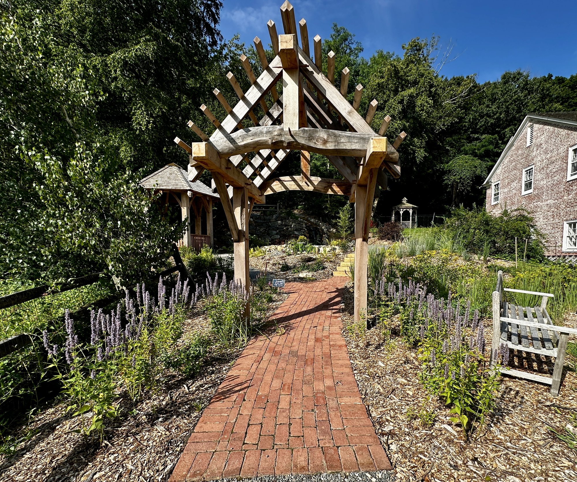 The stone grotto at St. John's, Cold Spring Harbor — where the garden gives way to the hillside